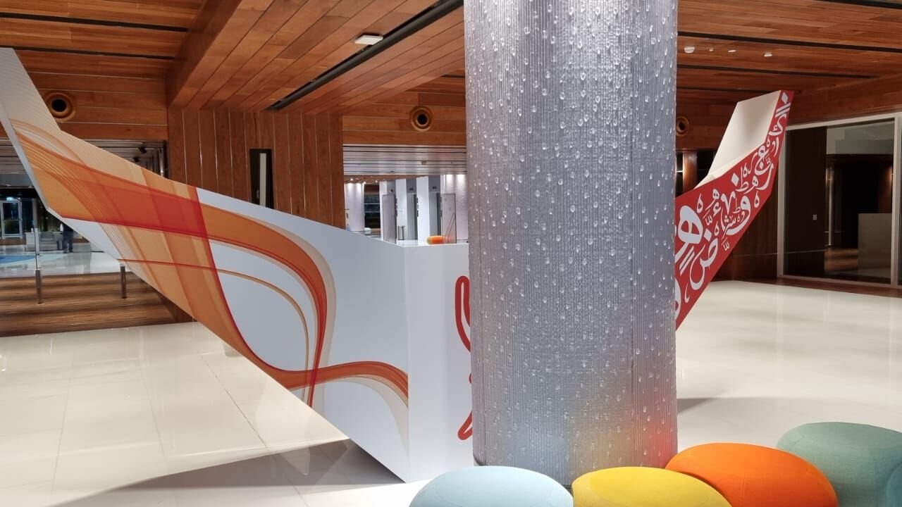 Mall feature wrap — printed calligraphy installation